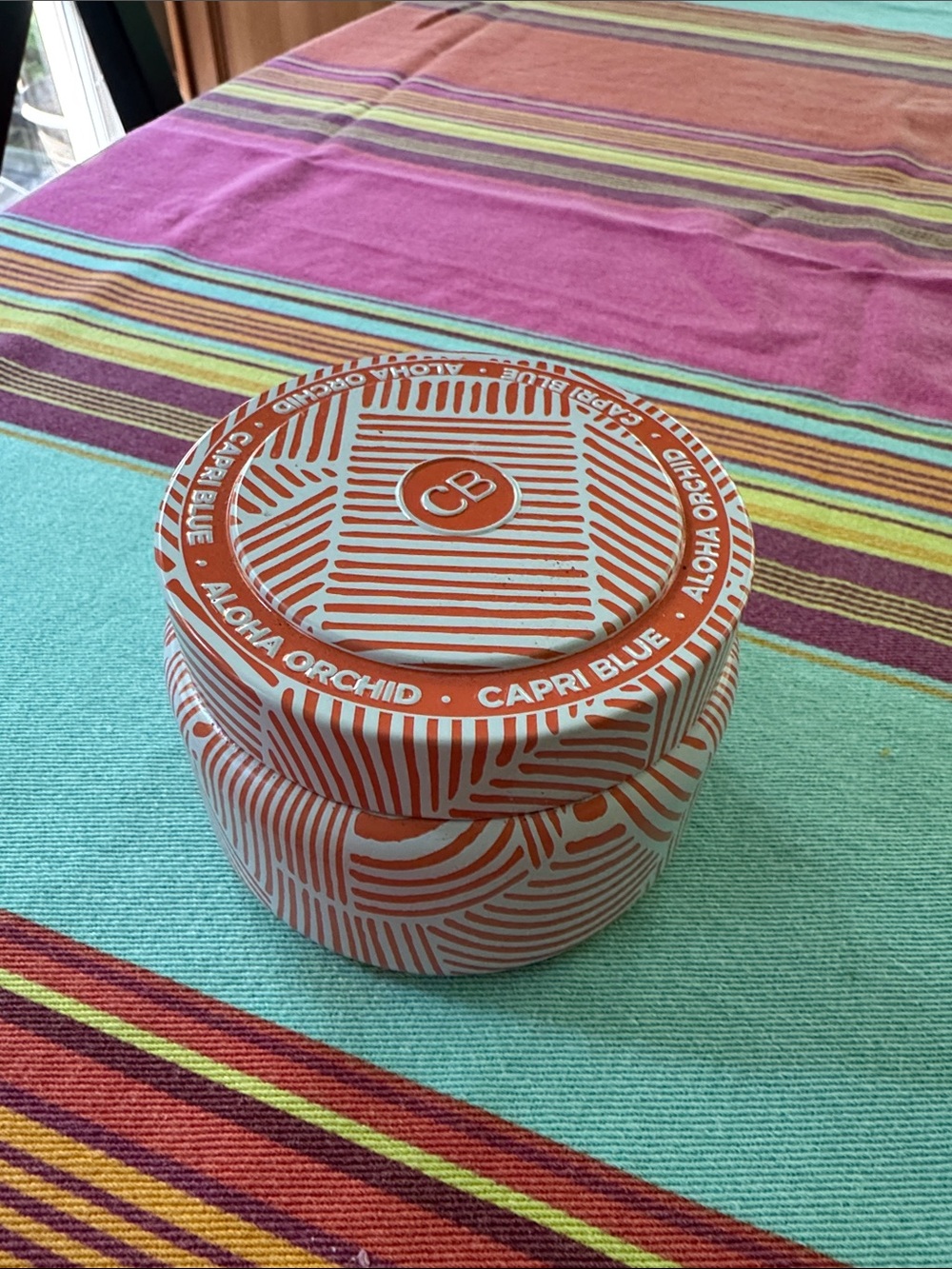 Capri Blue Aloha Orchid Decorative Candle in Tin - Orange & White